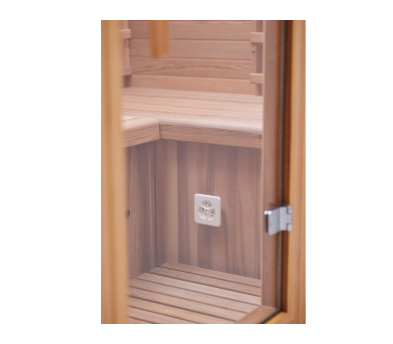 Moderne Infrarotkabine in einem stilvollen Wohnraum für optimale Entspannung.